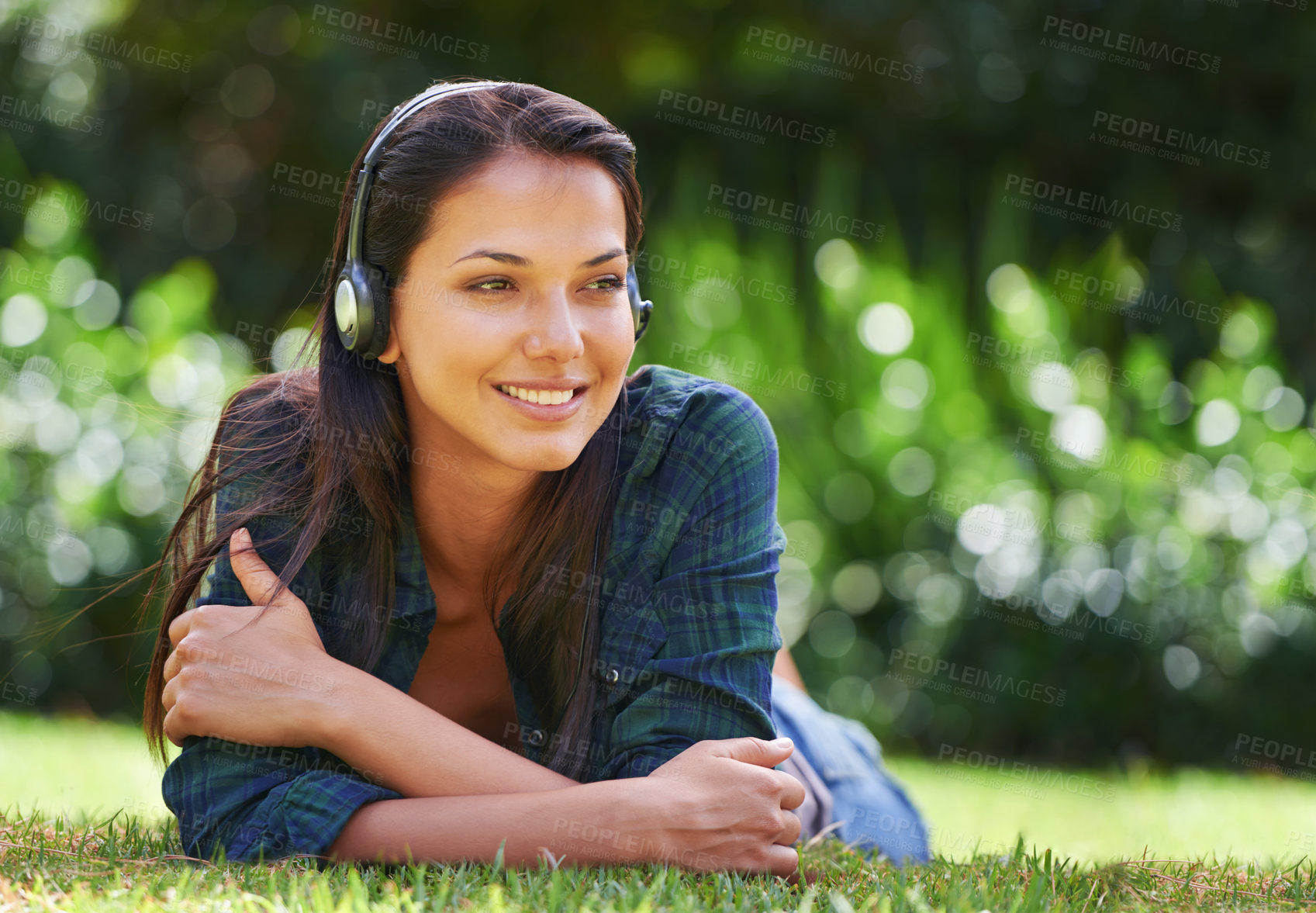 Buy stock photo Grass, thinking and woman with headphones, listening to music and streaming audio with peace, relaxing and sunshine. Person in a park, outdoor and girl with headset and podcast with radio and sound