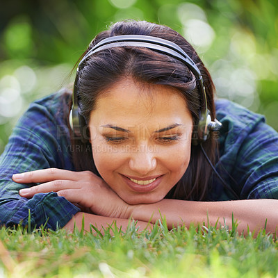 Buy stock photo Park, grass and woman with headphones, listening to music and streaming podcast with peace, relax and sunshine. Person in a backyard, outdoor or girl with headset or audio with radio, summer or sound