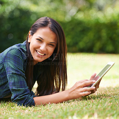Buy stock photo Smile, tablet and portrait of woman on grass in nature networking on social media, app or internet. Happy, digital technology and female person relaxing on lawn in outdoor garden, field or park.