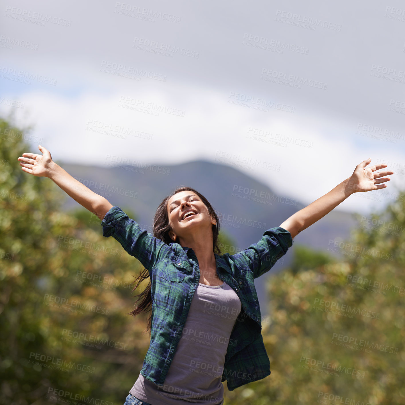 Buy stock photo Freedom, smile and hands raised with young woman in garden of home for enthusiasm or inspiration. Nature, relax and wellness with happy person outdoor at park in summer for energy or excitement