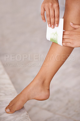 Buy stock photo Closeup, leg and woman with waxing, skincare and wellness with dermatology and aesthetic in a bathroom. Person, lady and girl with hair removal and cosmetics with product and clear with healthy skin