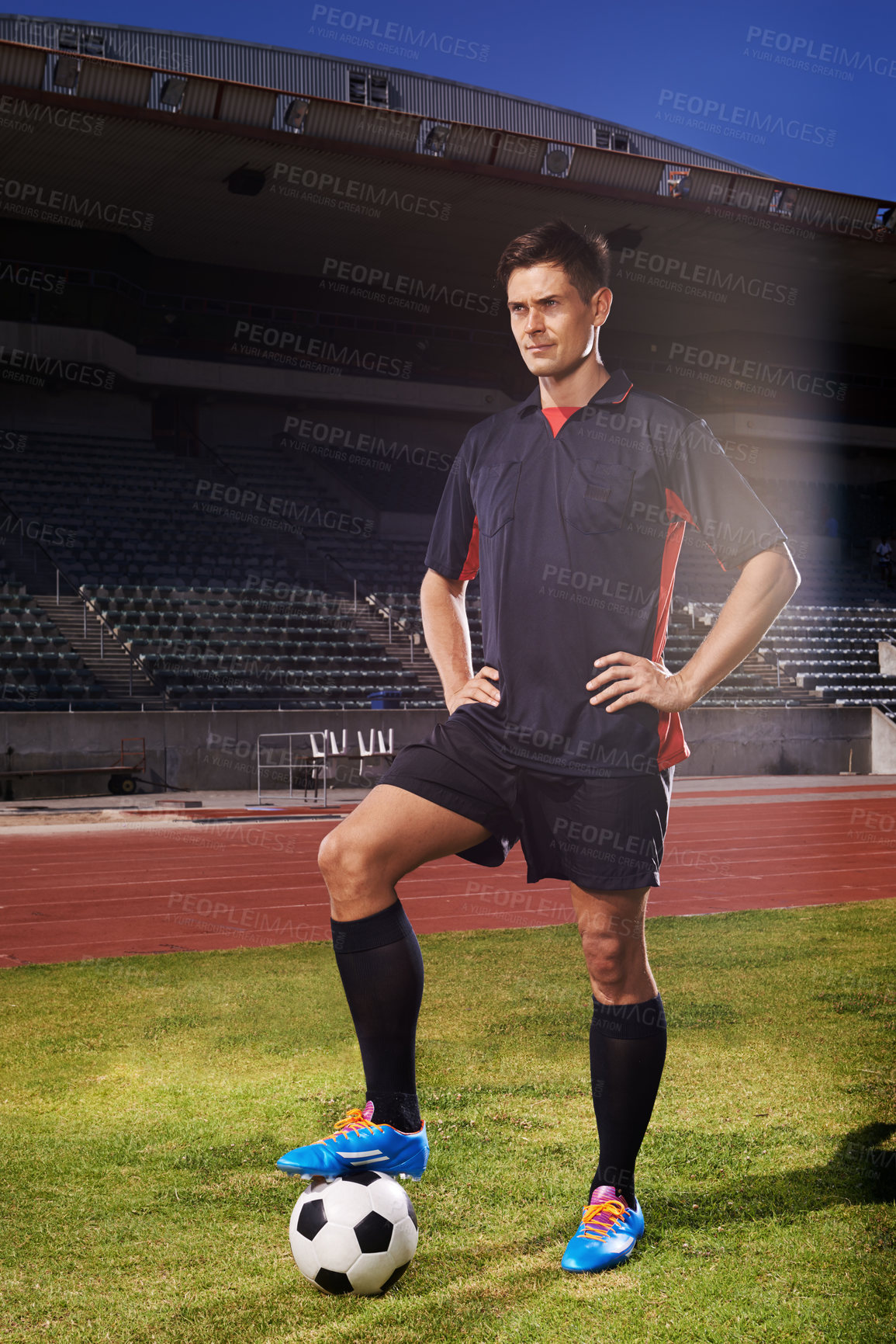 Buy stock photo Man, stadium and confident with football for game in workout or practice, fitness and competitive in France. Male person, player and training for sport or soccer career with exercise  for match