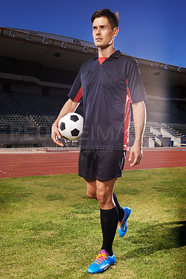 Buy stock photo Man, exercise and confident soccer player in stadium, athlete and competitive for match or game. Male person, serious face and determined for competition, outdoors and focus for football challenge