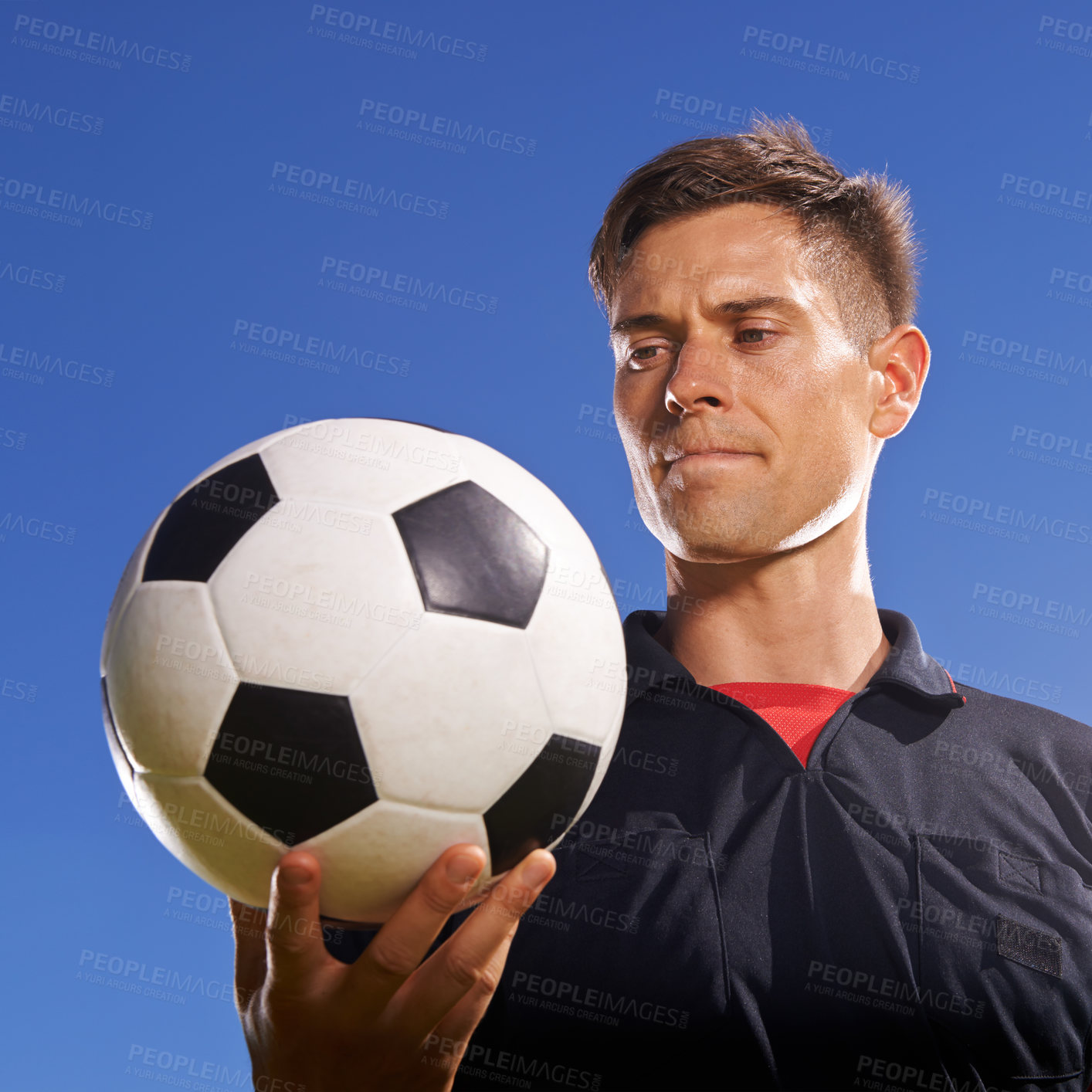 Buy stock photo Face, soccer and ball with man on blue sky background as referee for competition, game or match. Fitness, football and sports with serious person outdoor for beginning or start of tournament