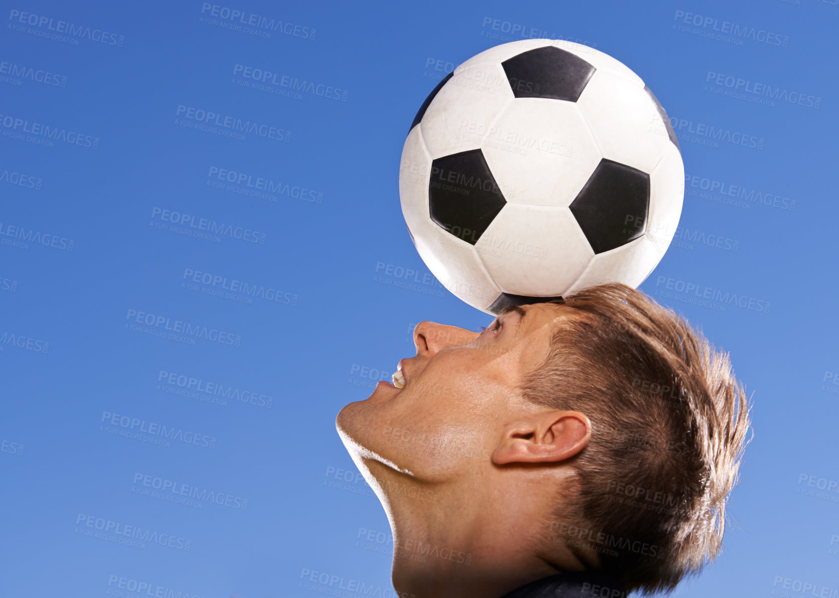 Buy stock photo Football, bounce and head with man, sports and training with competition and exercise. Person, blue sky and player with practice for a game or athlete with skills and technique with fitness or soccer