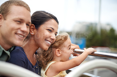Buy stock photo A young family seeing the city on the top of a bus
