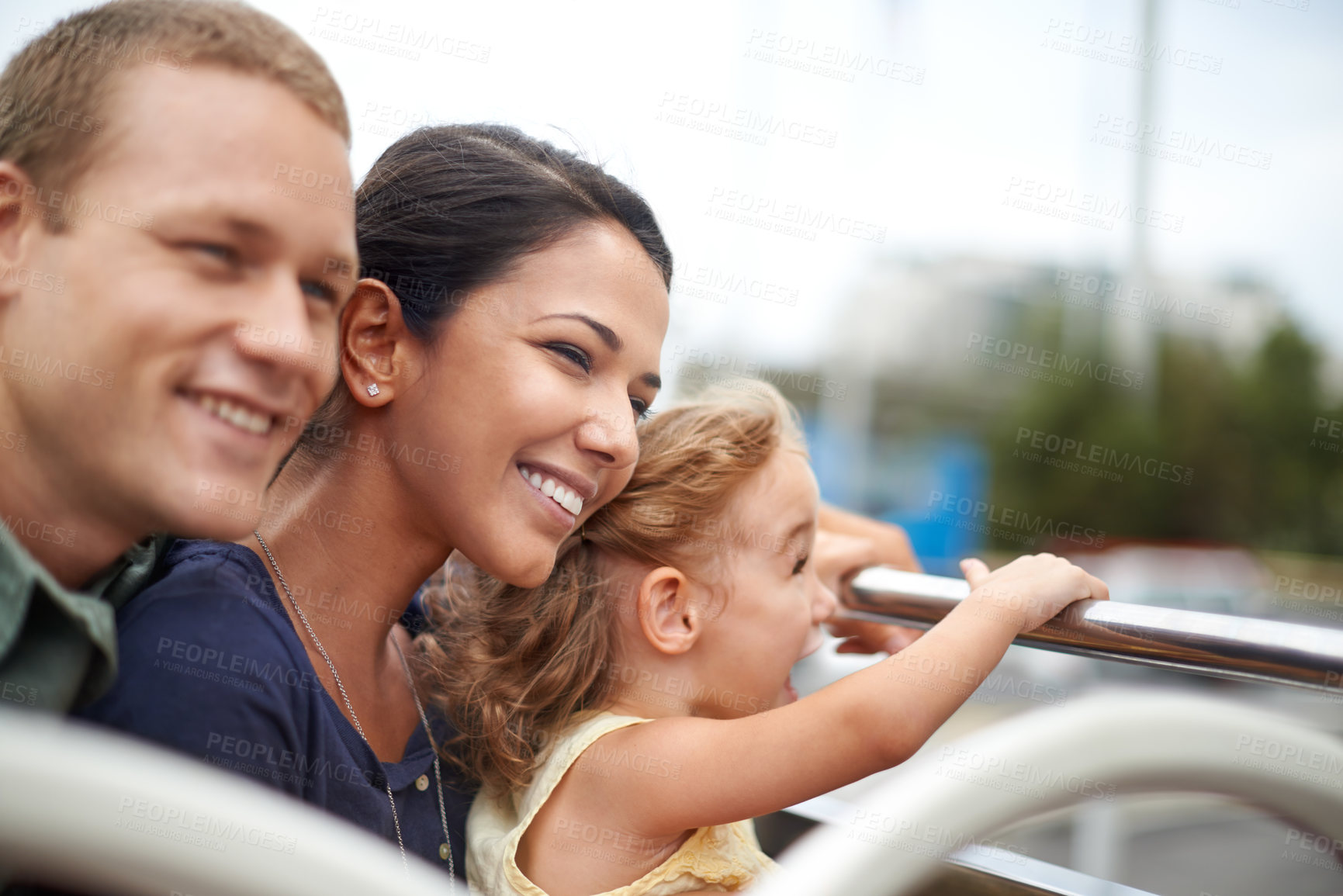 Buy stock photo A young family seeing the city on the top of a bus