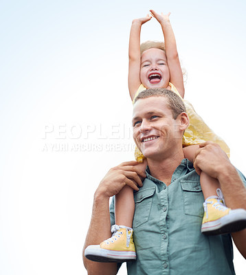 Buy stock photo Shot of a young father carrying his daughter on his  shoulders