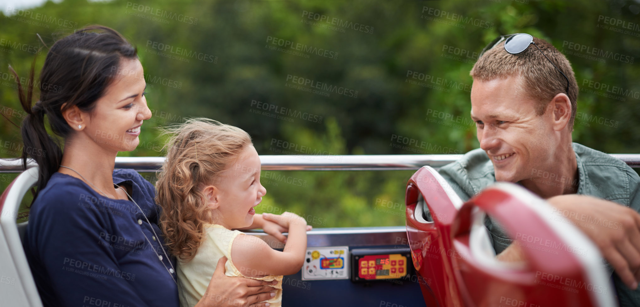 Buy stock photo Amusement park, smile and happiness for family with toddler, mother and father together with kid. Holiday, woman and man with girl in transport for fun, laughter and joy with child in America