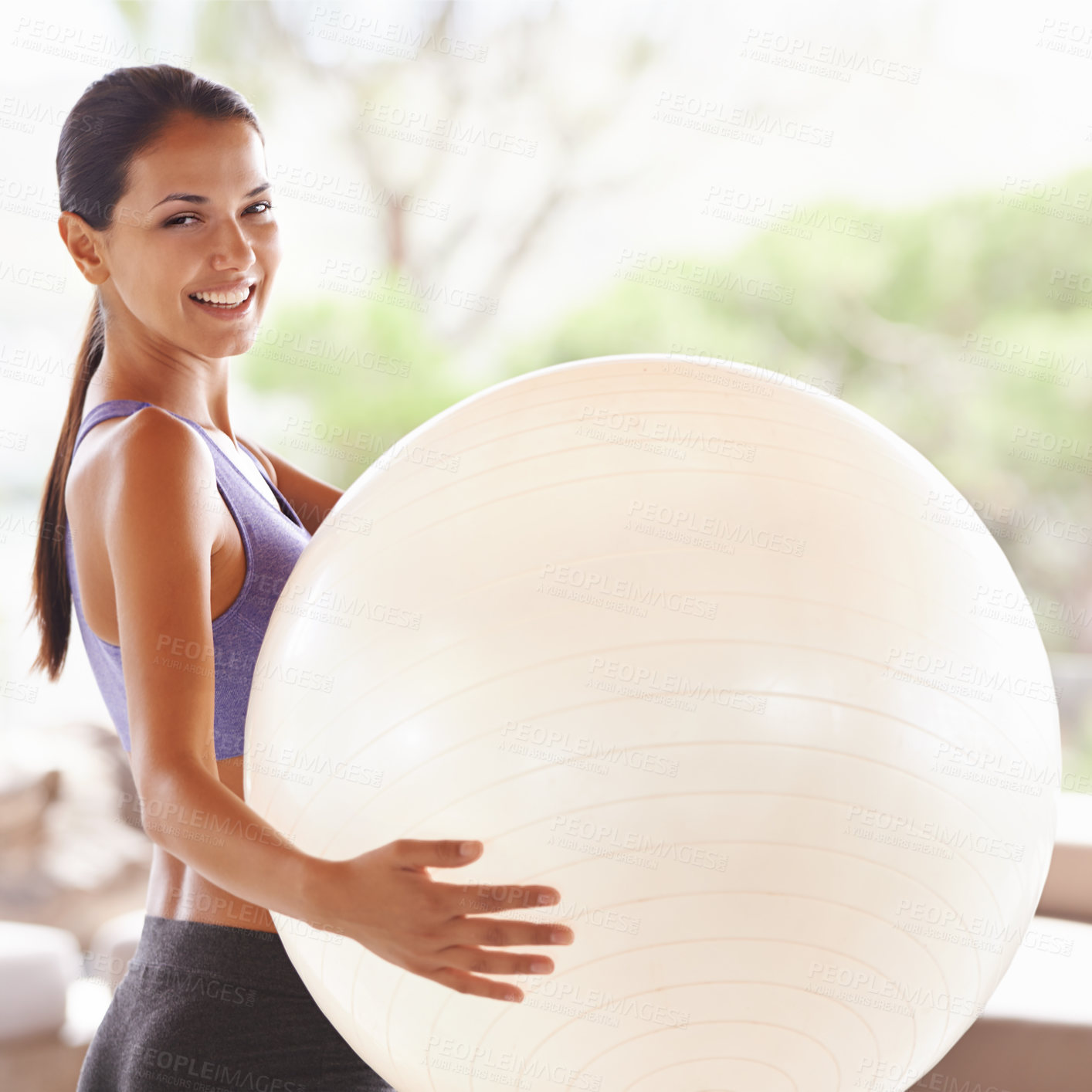 Buy stock photo Portrait of a beautiful young woman holding an exercise ball at home