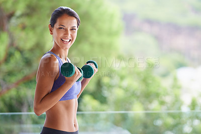 Buy stock photo A portrait of a beautiful young woman lifting dumbbells outdoors