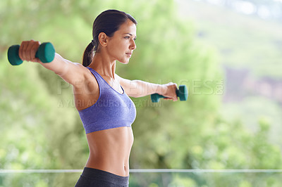 Buy stock photo Woman, weightlifting and exercise with dumbbells for training, workout or muscle gain on outdoor balcony. Young female person with small barbells for sport, fitness or health and wellness in nature