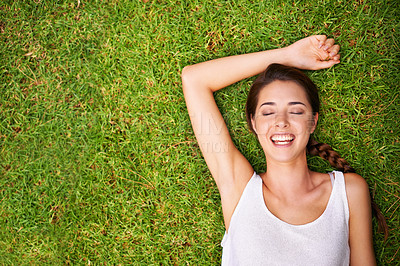 Buy stock photo Woman, portrait and happy on grass with top view for relax with confidence, mockup space and weekend break in summer. Young person, face and smile on lawn, garden and backyard of home for fresh air