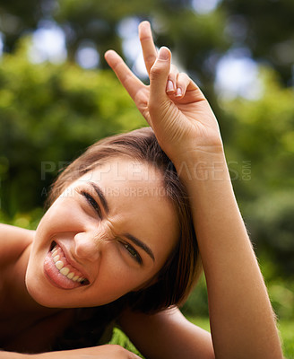 Buy stock photo Peace, sign and gesture for woman in garden or outdoor with tree and sunshine for silly and symbol. Young person and portrait with finger for two or funny for face and crazy with smile for joy