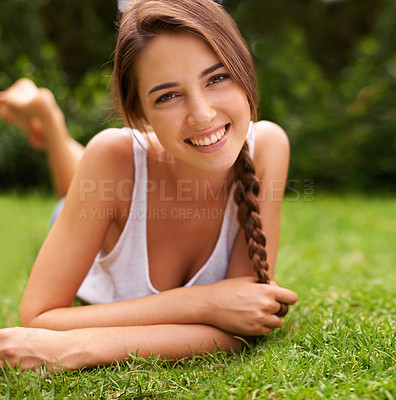 Buy stock photo Woman, portrait and happiness in garden for relax with sunshine, enjoyment or weekend break in summer. Young person, smile or confident on lawn, grass or backyard of home for fresh air in environment