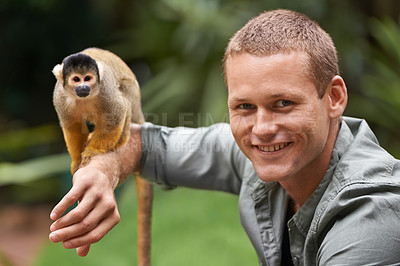 Buy stock photo Man, portrait and monkey at nature zoo as sanctuary veterinary for rehabilitation trust, support or protection. Male person, face and animal in sustainable environment in Indonesia, holiday or travel