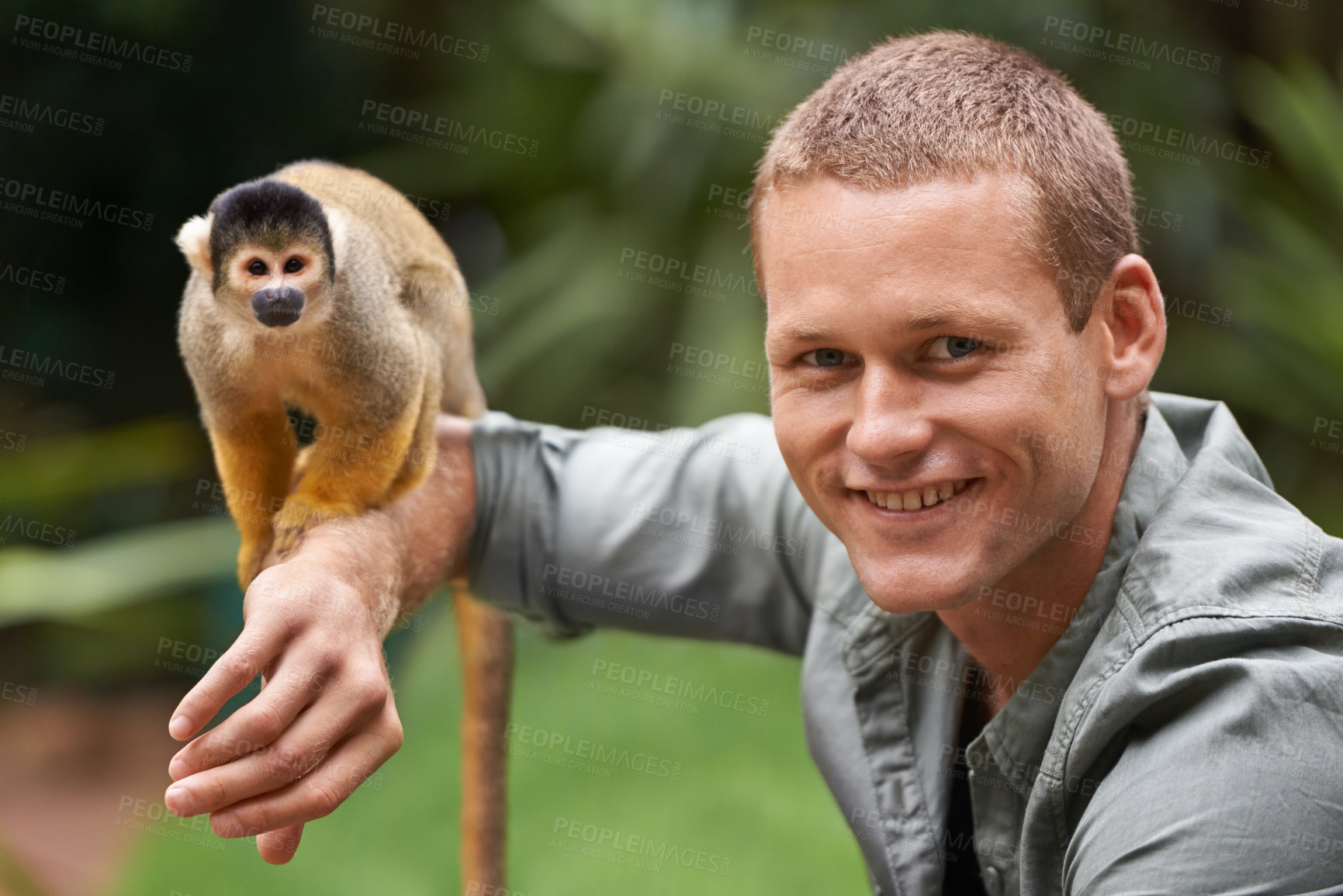 Buy stock photo Man, portrait and monkey at nature zoo as sanctuary veterinary for rehabilitation trust, support or protection. Male person, face and animal in sustainable environment in Indonesia, holiday or travel