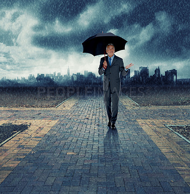Buy stock photo Businessman, umbrella and walking for security in rain, insurance at crossroads by city background for choice. Mature person, winter and street with dark clouds in storm and future decision for path