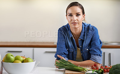 Buy stock photo Cooking, kitchen and portrait of woman with vegetables on wooden board for wellness, meal prep and nutrition. Healthy diet, home and person with ingredients for vegetarian dinner, lunch and supper