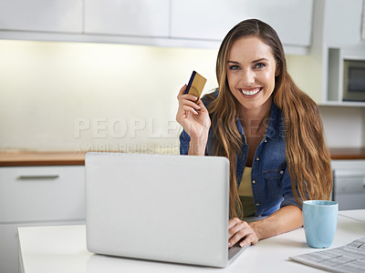 Buy stock photo Shot of a young woman doing some online shopping