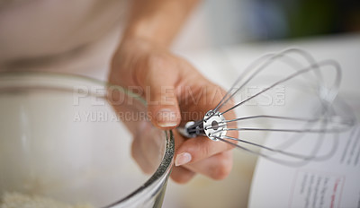 Buy stock photo Hands, person and whisk with cookbook, kitchen and bowl for baking. Baker, muffin or pastry and food with countertop, apron and cooking for recipe preparation and recreation or hobby at home or house