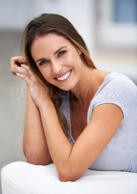 Buy stock photo Portrait of a young woman smiling at the camera