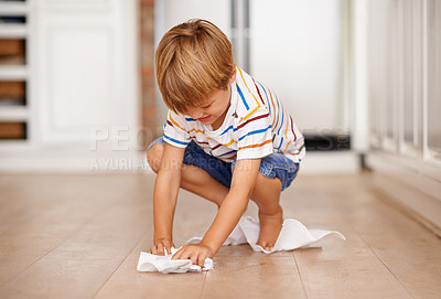 Buy stock photo Shot of a little boy playing on the floor