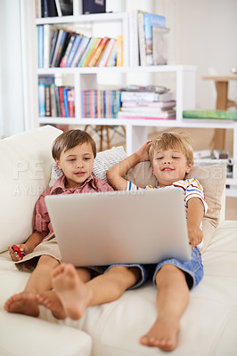 Buy stock photo Laptop, smile and kids on sofa in home to relax, learning and family streaming cartoon on internet together. Computer, children and boys in living room for education, movies or brothers with games