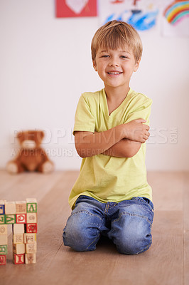 Buy stock photo Smile, portrait or kid with building blocks for playing and learning for development or growth in playroom. Relax, playful or happiness with activity, young child toddler and fun games for creativity