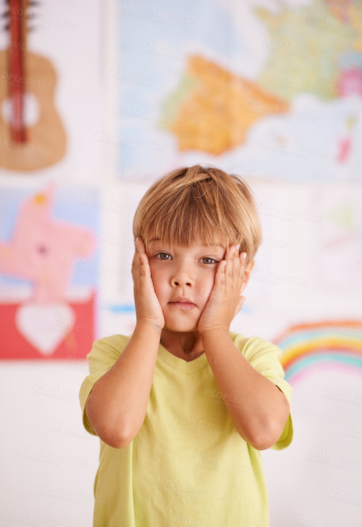 Buy stock photo Child, boy and hands on face for stress or worry in playroom, anxiety with serious facial expression and fear. Scared, concern or unhappy with fail or mistake, negative reaction for crisis or problem