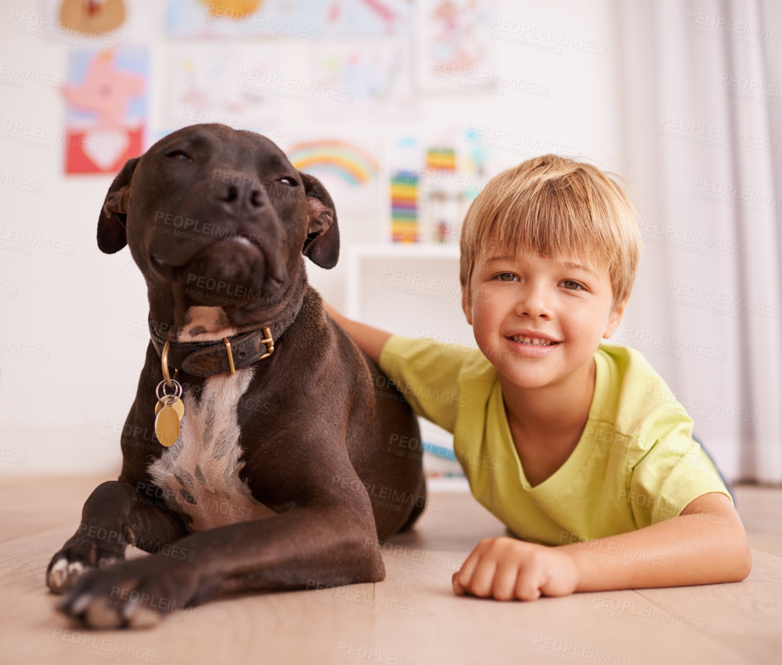 Buy stock photo Boy child, dog and portrait, happy with pet and friends in playroom for love and loyalty at home. Youth, kid and bonding with puppy, adoption or foster for animal care and relax on floor with smile