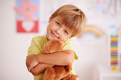 Buy stock photo Portrait of a cute little boy hugging his stuffed animal