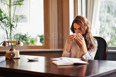Buy stock photo Woman, drink and writer with coffee in office to relax before writing on desk, paper or notebook with ideas. Person, thinking and enjoy tea with remote work in home as journalist planning article