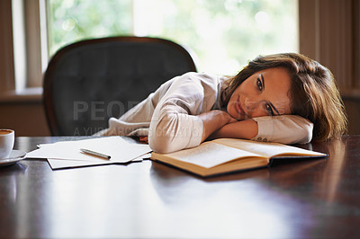 Buy stock photo Tired, woman and portrait of studying on table with research, notes and paper in library at college. Student, relax and rest on desk with writing, project or fatigue from burnout at university