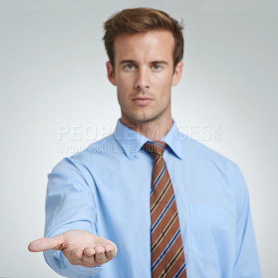 Buy stock photo Business, man and portrait in studio with palm open for support or donation, isolated and serious. Male person, corporate and charity or begging for finance, loan and hand gesture on white background