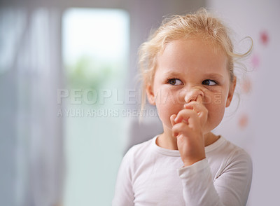 Buy stock photo A little girl picking her nose