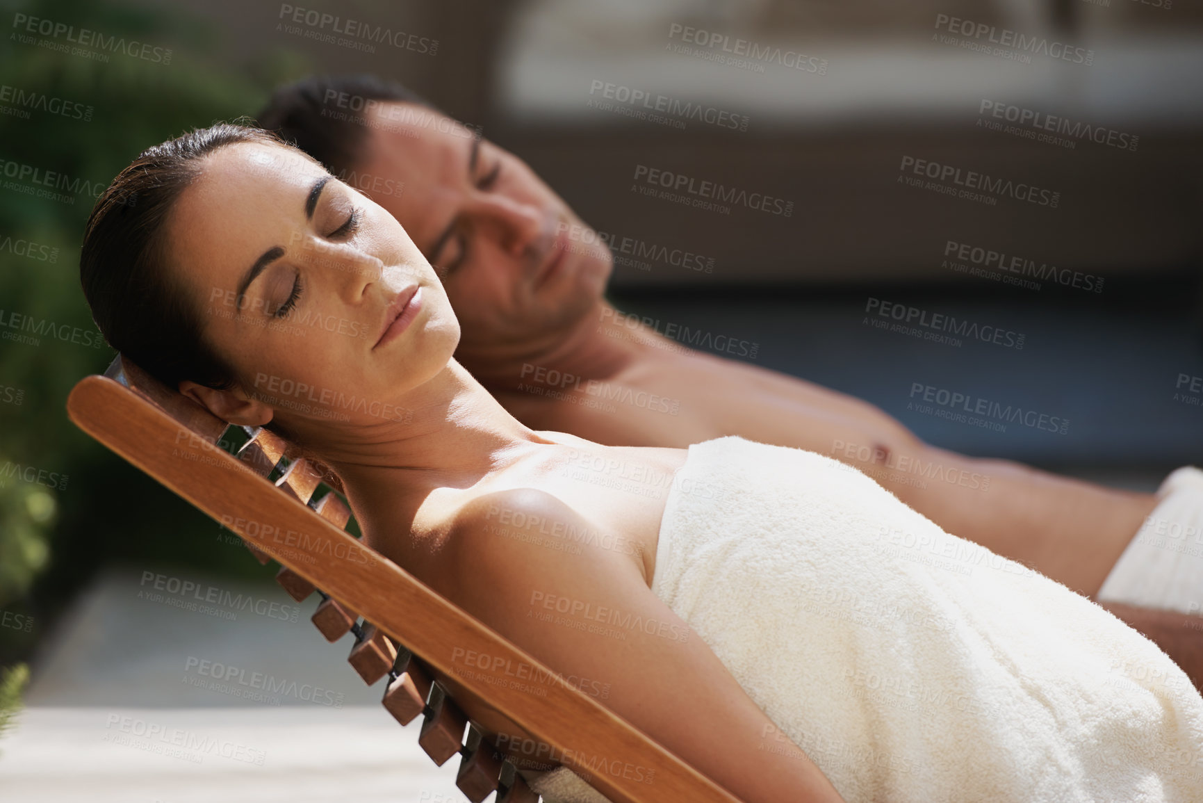 Buy stock photo Sleep, relax and couple at hotel pool with smile, sunshine and holiday together at wellness spa getaway. Hospitality, happy woman and man at luxury villa for travel, vacation or love on romantic date