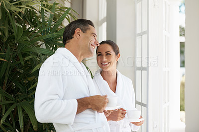 Buy stock photo Shot of a loving mature couple enjoying a cup of coffee at a day spa