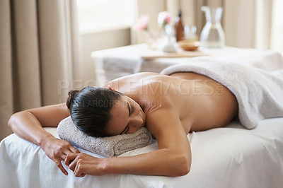 Buy stock photo Relax, massage and woman at spa for skincare, peace and calm at luxury resort. Beauty, therapy and person at salon for body treatment, health and resting at table for service to pamper for wellness