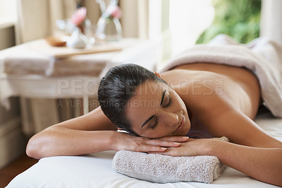 Buy stock photo Spa, treatment and zen woman on massage table, salon and beauty therapist in wellness centre. Peaceful, smile and reflexology for body and relax, pamper and skin care for sleeping female client 