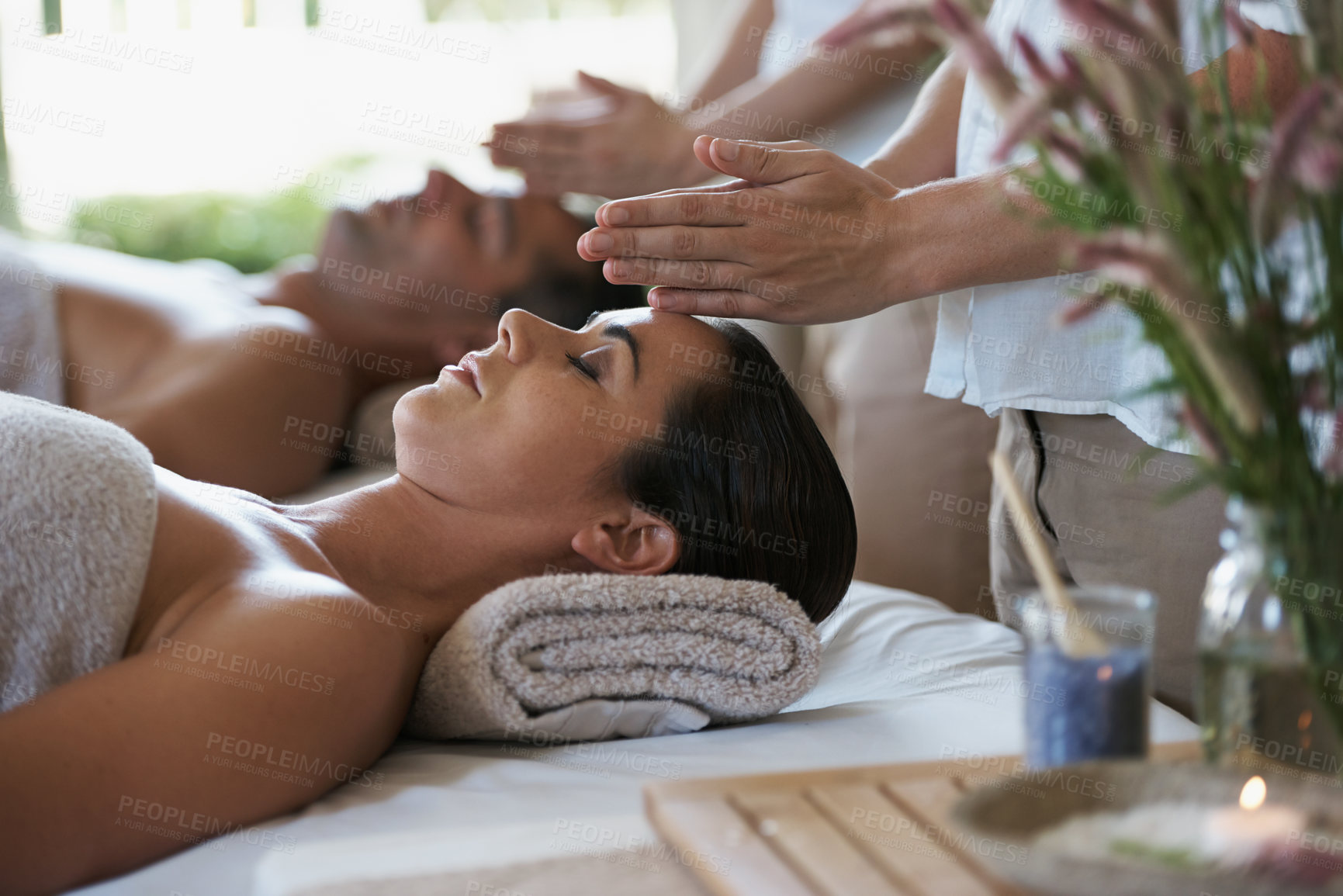 Buy stock photo Sleep, head massage and couple relax in spa for care of body with rest on table of retreat for honeymoon. Hotel, man and woman together in resort for health, wellness and luxury  for skincare