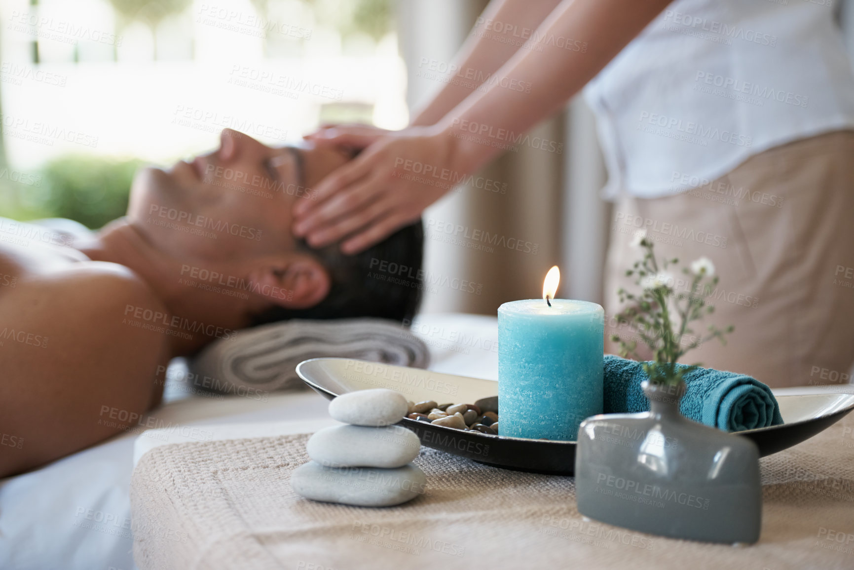 Buy stock photo Luxury, facial massage  and man relax in spa with aromatherapy candle for holistic treatment. Hotel, peace and health for male person, wellness and rest in resort for holiday  for skincare in break