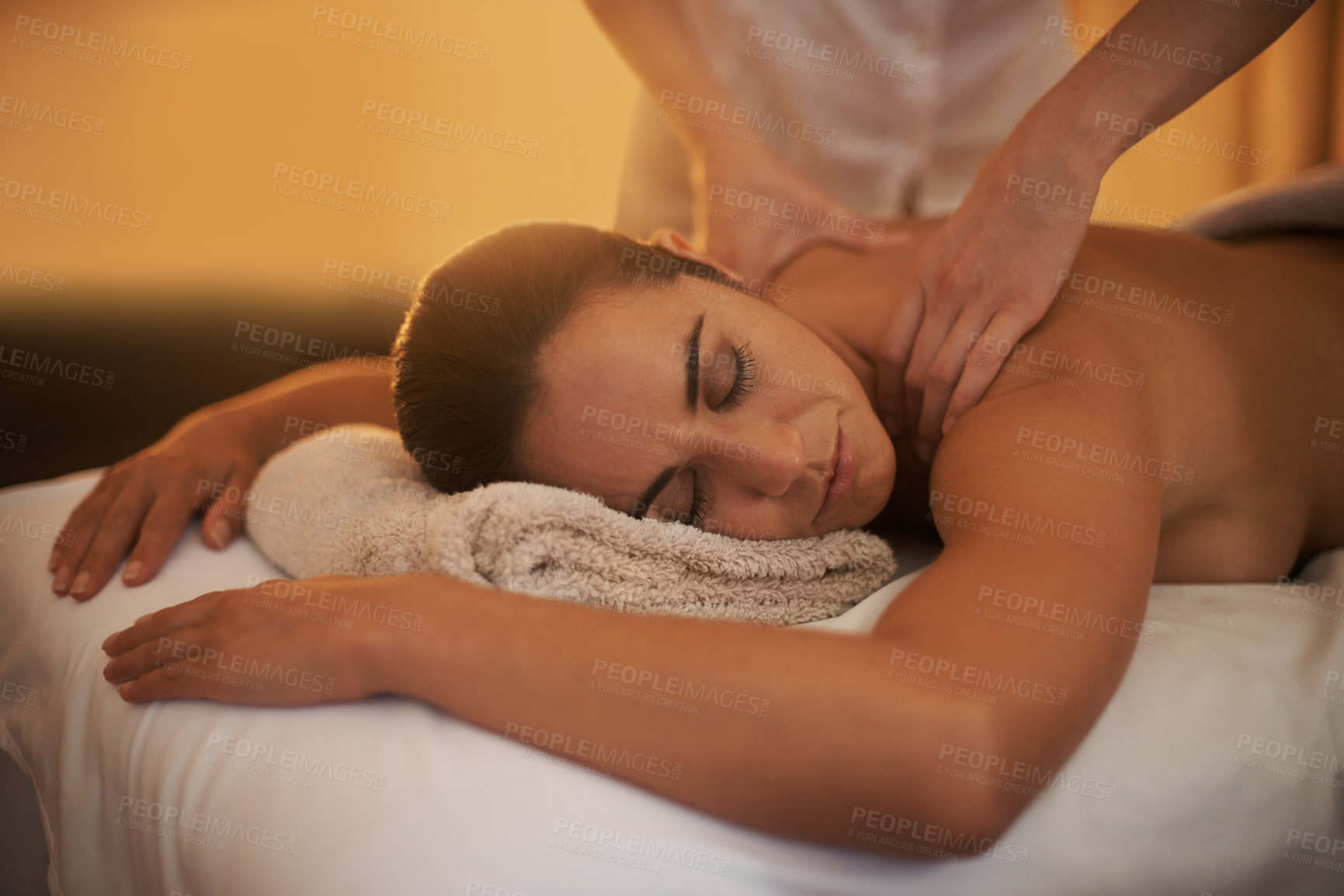 Buy stock photo Relax, back massage and woman at spa for skincare, peace and calm at luxury resort at table. Beauty, therapy and person at salon for body treatment, health and hands of masseuse pamper for wellness