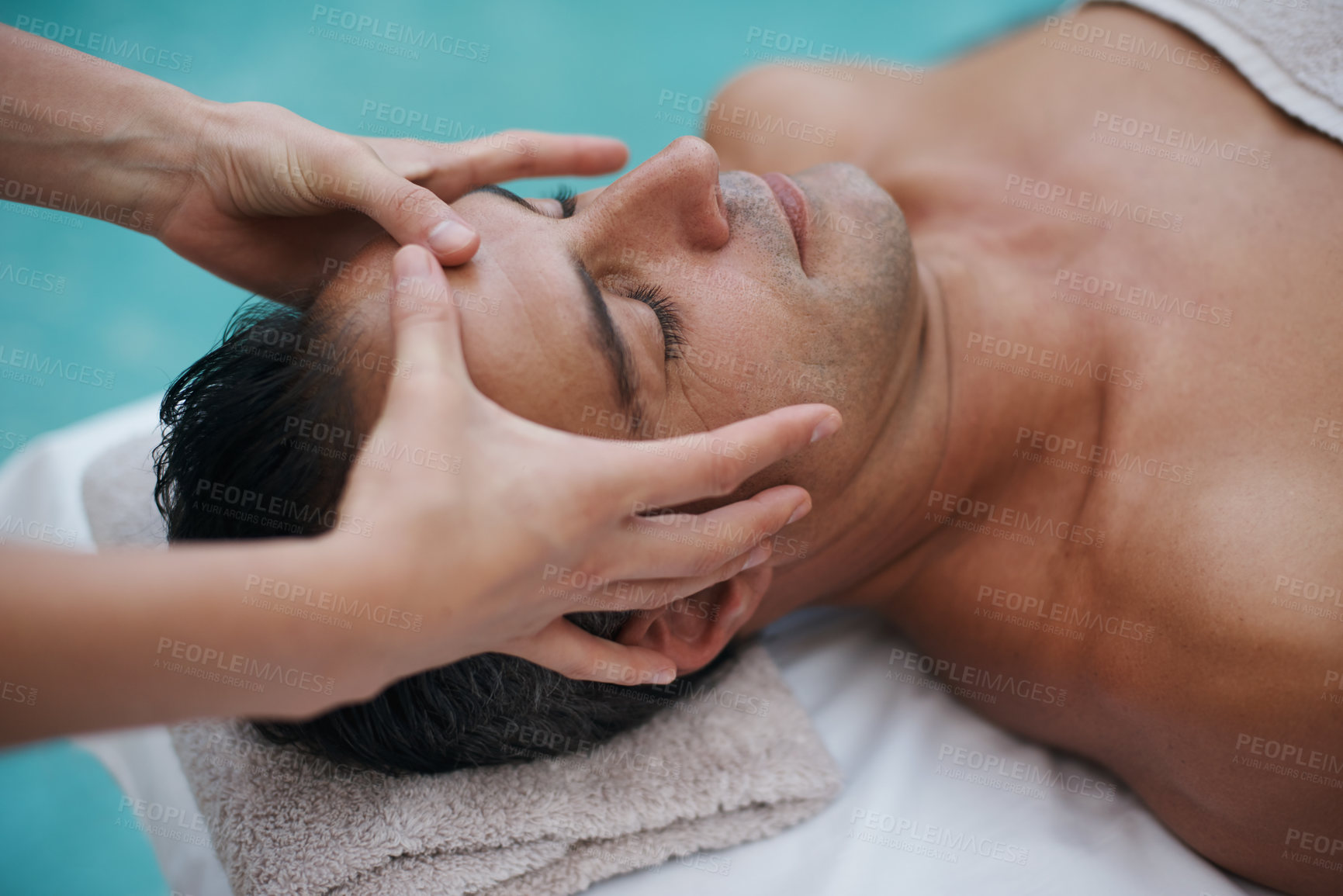 Buy stock photo Spa, man and hands with massage for relax at resort, luxury hotel and vacation for wellness and therapeutic pamper. People, masseuse and body care with head treatment, hospitality and zen by poolside