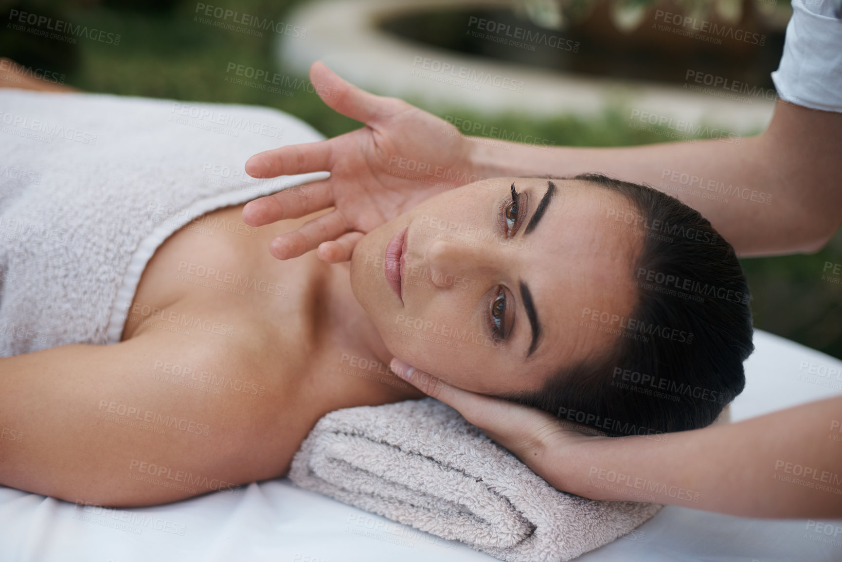 Buy stock photo Spa, woman and face with massage for wellness at resort, luxury hotel and vacation for relax and therapeutic pamper. People, masseuse and body care with facial treatment, hospitality and zen outdoor