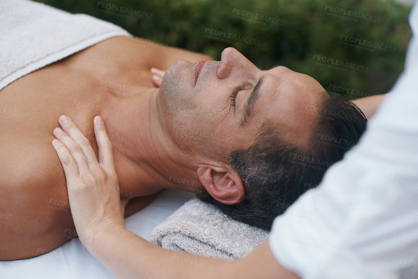 Buy stock photo Spa, man and hands with massage for relax at resort, luxury hotel and vacation for relax and therapeutic pamper. People, masseuse and body care with shoulder treatment, hospitality and zen outdoor