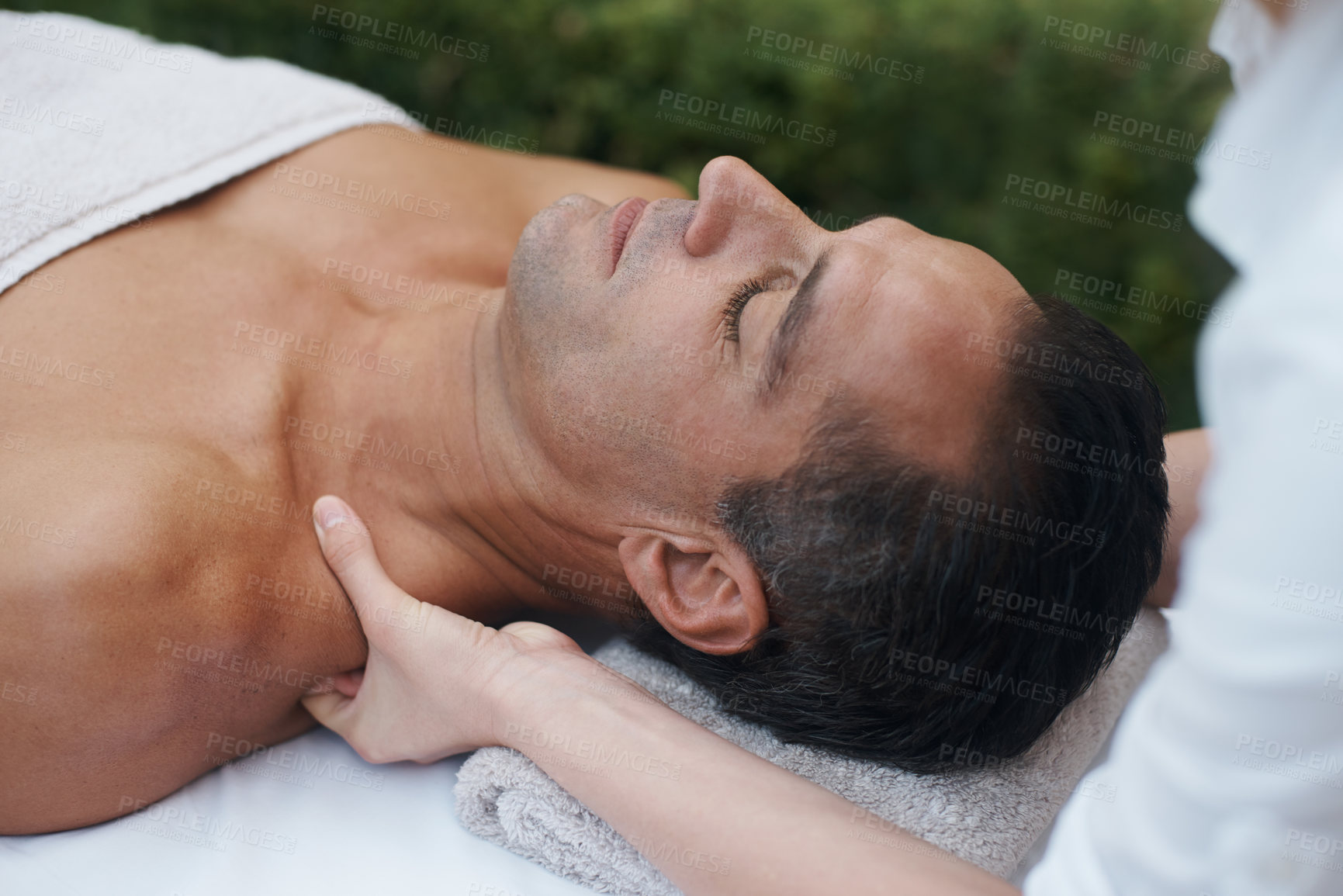 Buy stock photo Spa, man and shoulder with massage for relax at resort, luxury hotel and vacation for wellness and therapeutic pamper. People, masseuse and body care with skin treatment, hospitality and zen outdoor