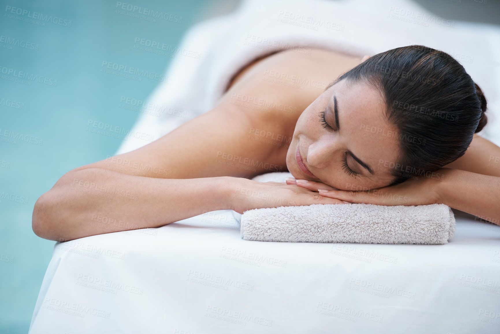 Buy stock photo Luxury, spa and woman relax for massage on table in hotel, calm and care for body in vacation. Holiday, outdoor and female person on break for weekend, accommodation and lodge for skincare in resort
