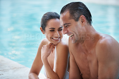 Buy stock photo Cropped shot of a loving mature couple relaxing in a pool