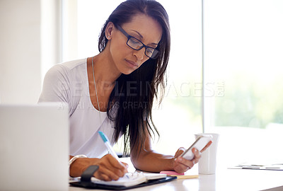 Buy stock photo Shot of a beautiful seamtress in her boutique